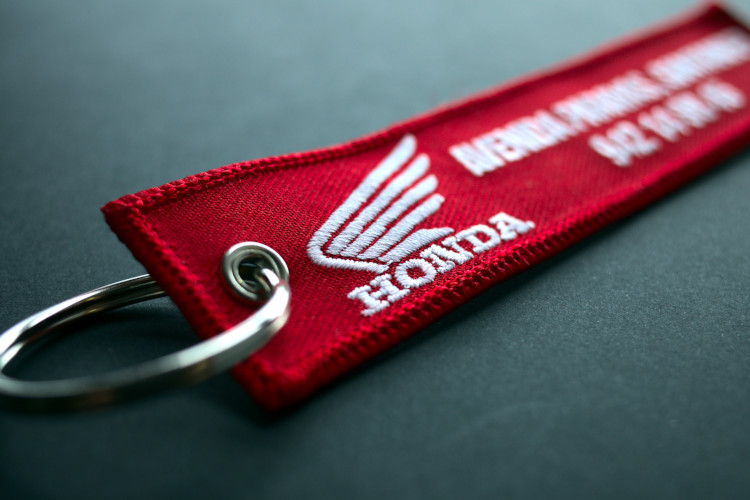 Honda embroidered keychain with red background and white logo & slogan
