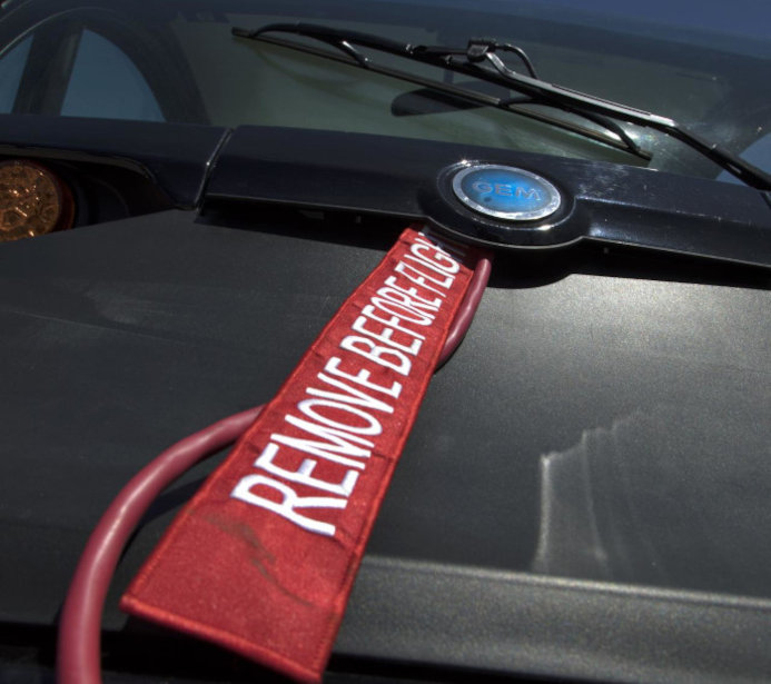 Aviation Safety: Red Security Ribbons Protecting the Cockpit Window